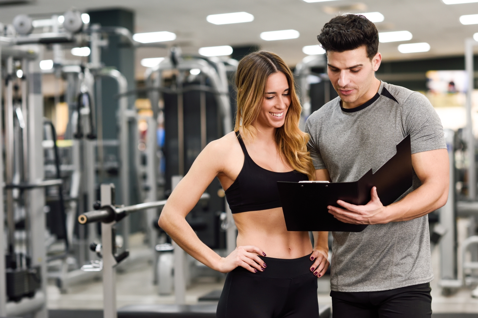 A trainer and his client going over a workout plan